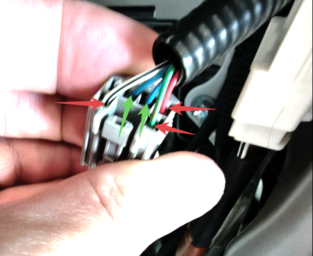blurry image of a connector annotated with all the wires labeled showing which ones are hot.